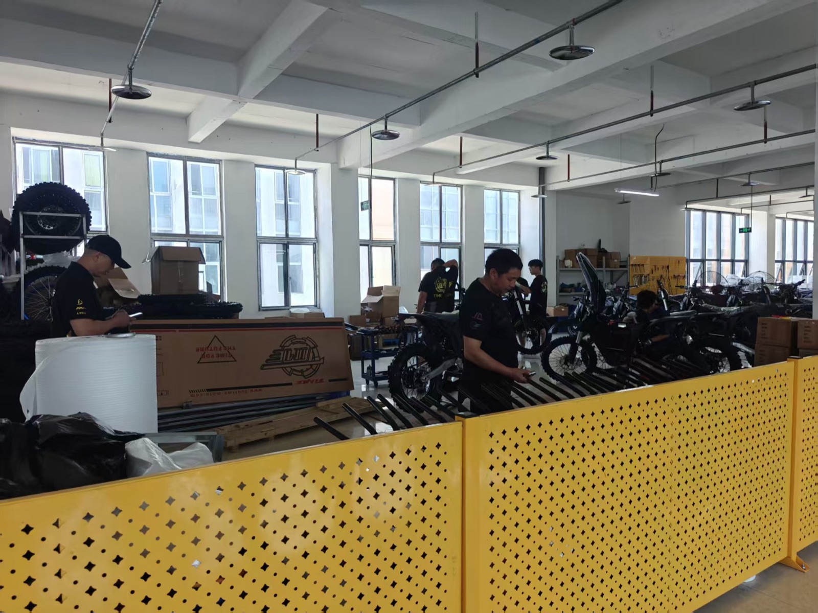 TAIMU engineers assembling off-road motorcycles in Chongqing