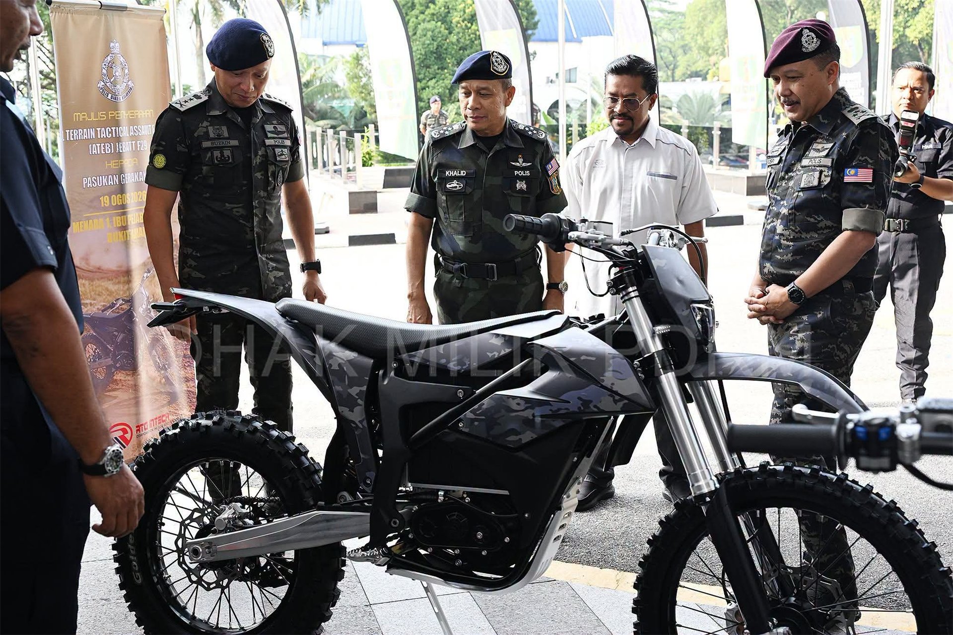 Royal Malaysia Police representatives inspecting an F29-based tactical electric motorcycle